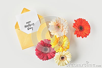 top view of happy mothers day greeting card and beautiful gerbera flowers Stock Photo