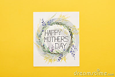 Top view of happy mothers day greeting card on colorful yellow background Stock Photo