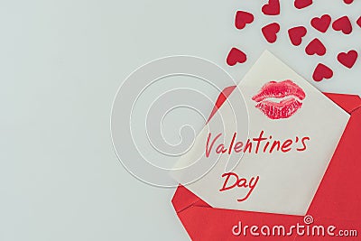 top view of happy valentines day postcard with lips print in envelope Stock Photo