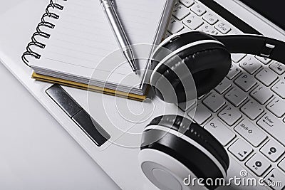 Top view headphones,book,pen,laptop on table is an online leaning concept Stock Photo