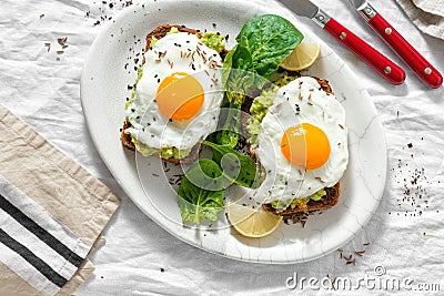 Top view healthy avocado toasts breakfast lunch avocado toast fried eggs white background Stock Photo
