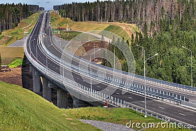 Top view of highway crossing forest, and bridge over river. Editorial Stock Photo