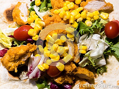 Top view on homemade chicken and vegetables tortilla Stock Photo