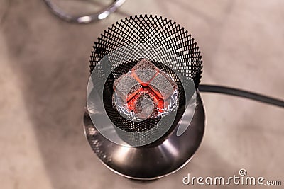 Top View Of The Hot Coals Smoldering On A Ceramic Bowl Of Hookah Stock Photo