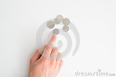 Top view human hand counting coins, russian rubles on white table, close-up. Financial problems, crisis, falling value of money Stock Photo