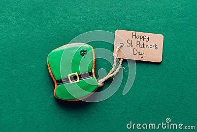 top view of icing cookie in shape of green hat on green, st patricks Stock Photo