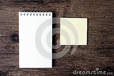Top view image of blank notebook and empty sticky note paper on Stock Photo