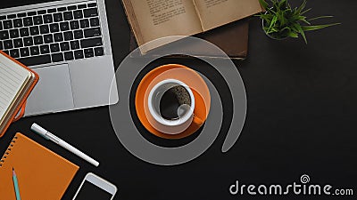 Top view image of Computer laptop, Coffee cup, Books, Potted plant, Notebook, Diary, Pen and Smartphone. Stock Photo