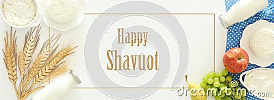 Top view image of dairy products and fruits on wooden background. Symbols of jewish holiday - Shavuot. Stock Photo