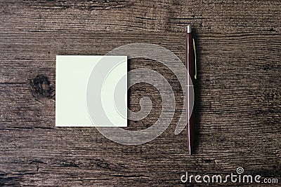 Top view image of empty sticky note paper and pen on the wooden Stock Photo