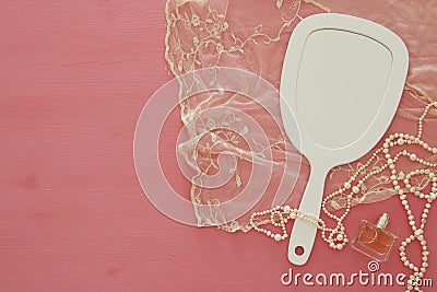 Top view image of vintage hand mirror and delicate female romantic scarf Stock Photo