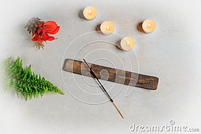 top view of incense and candles and orange flower on stone background Stock Photo