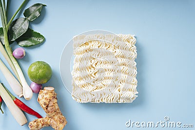 Top view - Instant noodle with Tom Yum ingredients over blue background Stock Photo