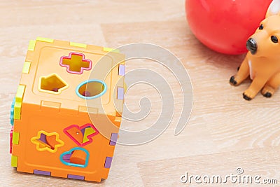 Top view of kids background with toys on white. Wooden cubes, colorful toy bricks, pencils, magnifying glass on blue background. Stock Photo