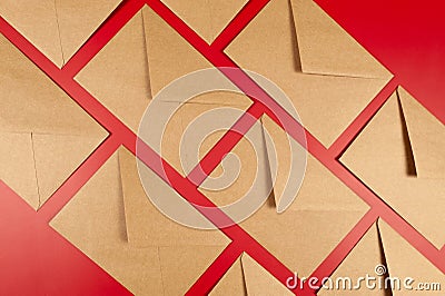 Top view of kraft envelopes on red background. Stock Photo