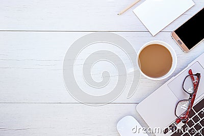 Top view laptop, glasses, empty note book, smartphone and coffee Stock Photo