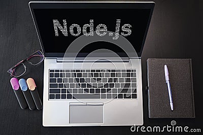 Top view of laptop with text Node.js. Node js inscription on laptop screen and keyboard. Learn node.js language, computer courses Stock Photo