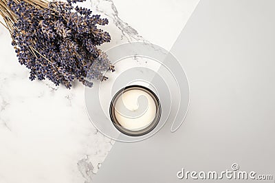 Top view of lavender flowers on grey and white marble background. Lavender bouquet, candle flat lay. Stock Photo
