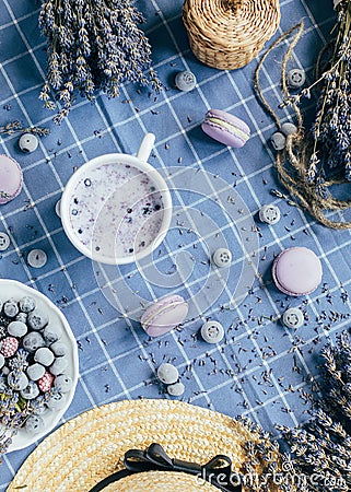 Top view of lavender macarons with spiced milk and frozen berries Stock Photo
