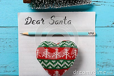 Letter paper with hand written Dear Santa and a pencil and a heart and a Christmas tree Stock Photo