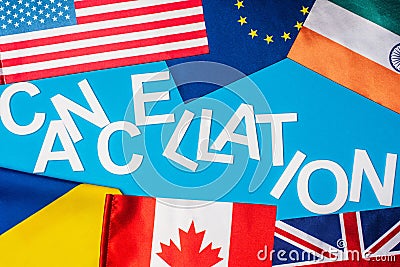 Top view of lettering cancellation near flags of countries Stock Photo