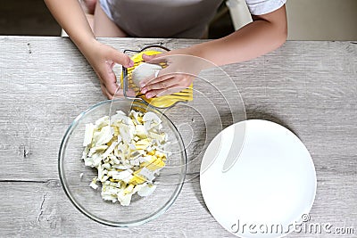 Top view lifestyle preschooler child girl cook food in the kitchen. development of fine motor skills in everyday life from scrap Stock Photo