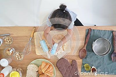 Top view little girl cooks Stock Photo