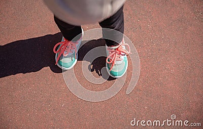 Little girl with sneakers and leggins training outdoors Stock Photo