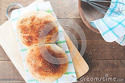 Top view loaf of homemade bread on wood background, soft filter Stock Photo