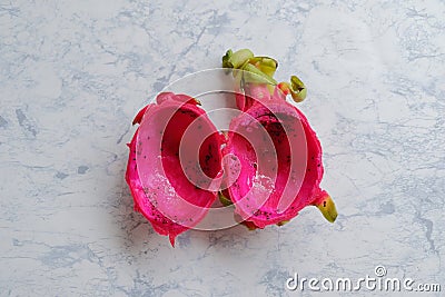 Top view of low calorie tropical Asian dragon fruit, cut in half with flesh already scooped out, leaving behind just the rind_ Stock Photo