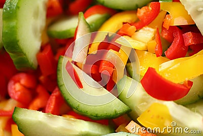 Top view macro sliced cucumber red and yellow peppers Stock Photo