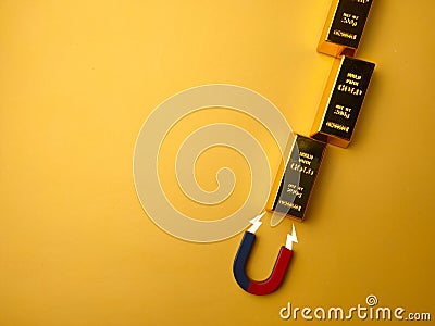 Top view magnet attract the gold bar Stock Photo