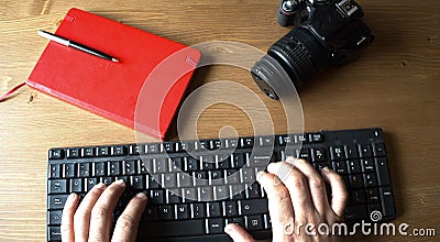 Top view of a male hand types text on the keyboard Stock Photo