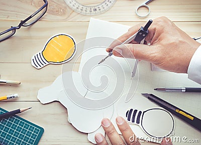 Top view of male hand using dividers with elements Stock Photo