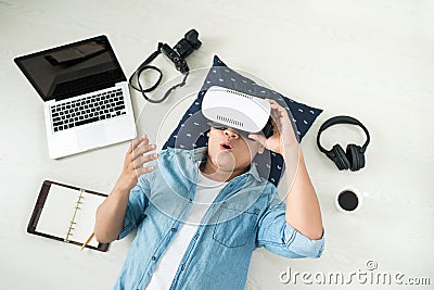 Top view of Man wearing virtual reality goggles Stock Photo