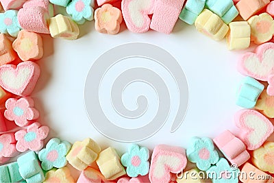 Top View of Many Pastel Color Flower Shaped and Heart Shaped Marshmallow Candies with Free Space for Text and Design Stock Photo