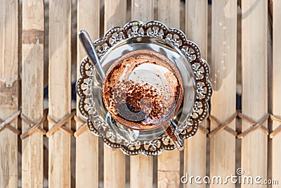 Top view of Marocchino is coffee drink from Alessandria, Italy. Served in a small glass and consists espresso cocoa powder and Stock Photo