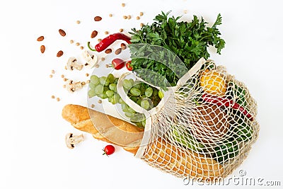 Top view of mesh shopping bag with groceries isolated on white background. Helthy food, plastic free and zero waste concept Stock Photo