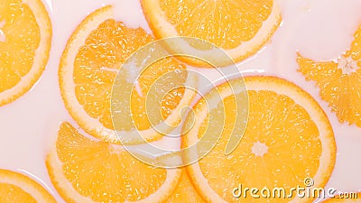 TOP VIEW: Milk fills an orange slices Stock Photo