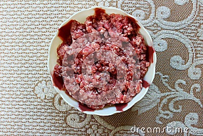 Minced mutton in a plastic bowl Stock Photo