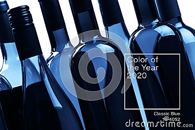 Top view minimalistic background. set of empty bottles of wine and glass . Web banner, greeting card idea. Concept color of Year Editorial Stock Photo