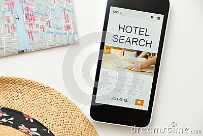 Top view of a mobile phone, hotel search on the screen Stock Photo