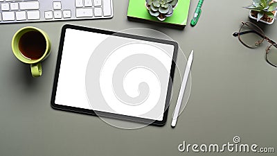 Top view of mock up digital tablet, stylus pen and coffee cup on table. Stock Photo