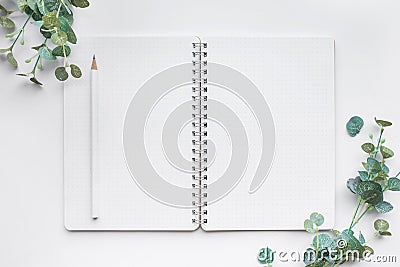 Top view of Mockup notepad and accessories in white background. Stock Photo