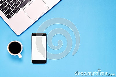 Top view, Modern workplace with laptop and smartphone, coffee. placed on a pastel background. Stock Photo