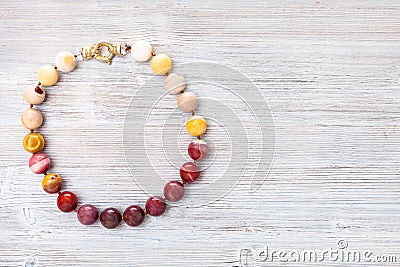 Top view of mookaite jasper necklace on gray Stock Photo