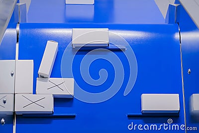 Top view - moving white small cardboard boxes on conveyor belt Stock Photo