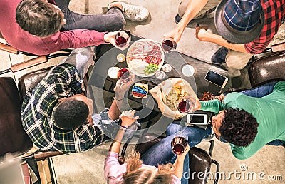 Top view of multiracial friends tasting red wine at bar winery Stock Photo