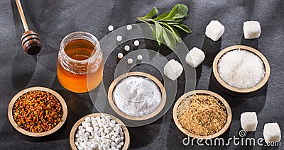 Sugar, stevia leaves, pollen and honey - Variety of natural sweeteners Stock Photo