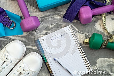 top view of new athletic equipment and notebook with pen. Stock Photo